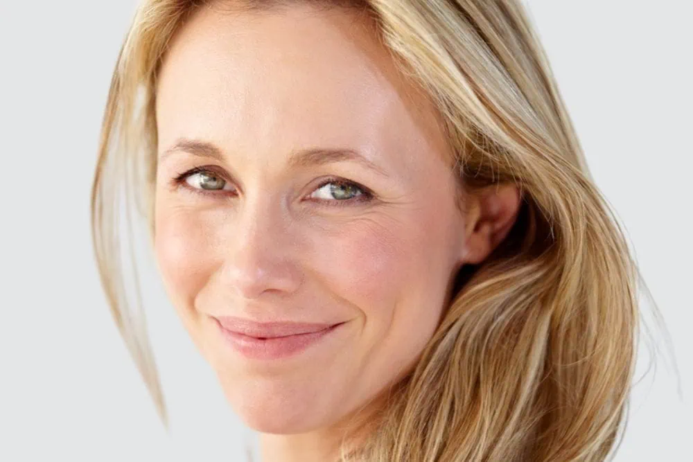 Smiling Woman Injectable Services at Emerge Aesthetics Botox, Dysport, Xeomin