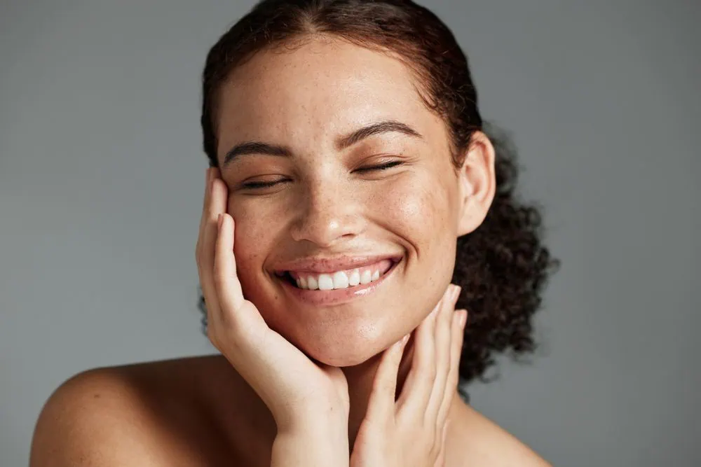 Woman Smiling Micro-Needling at Emerge Aesthetics