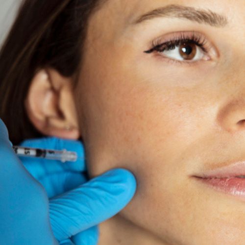Woman getting Botox for TMJ in jaw. TMJ treatment at Emerge Aesthetics.